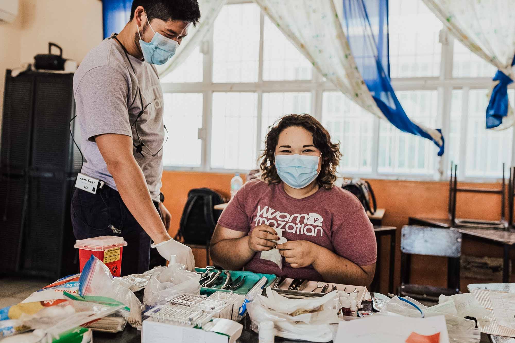 YWAM missionary volunteers prepare dental equipment to serve locals in Mazatlan, Mexico in a mobile medical brigade 