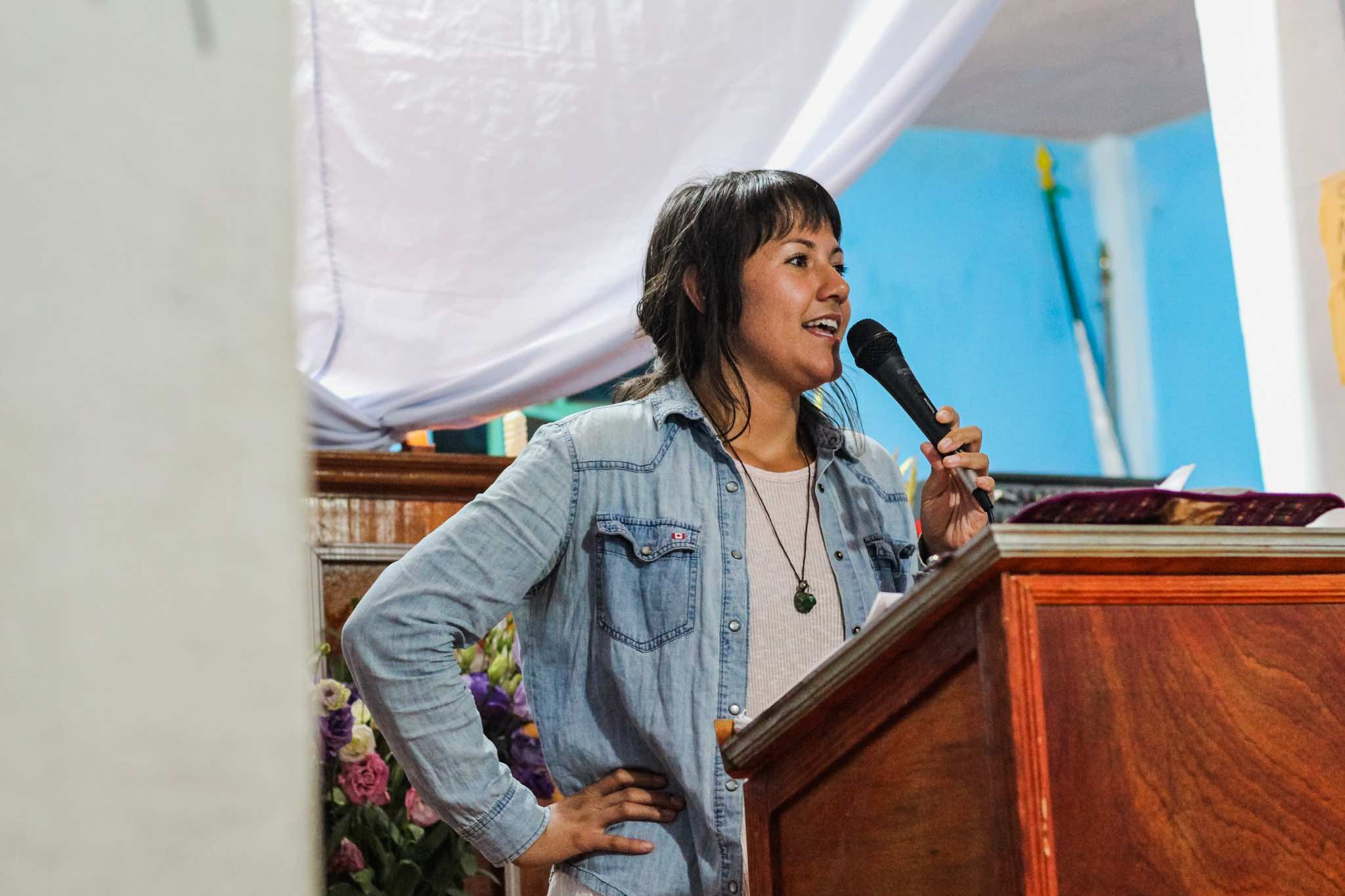 YWAM missionary woman speaking to a crow while on outreach